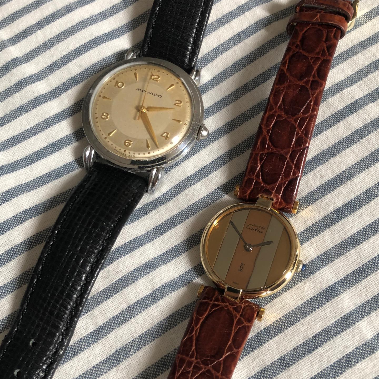Movado bullseye at upper left beside a Cartier